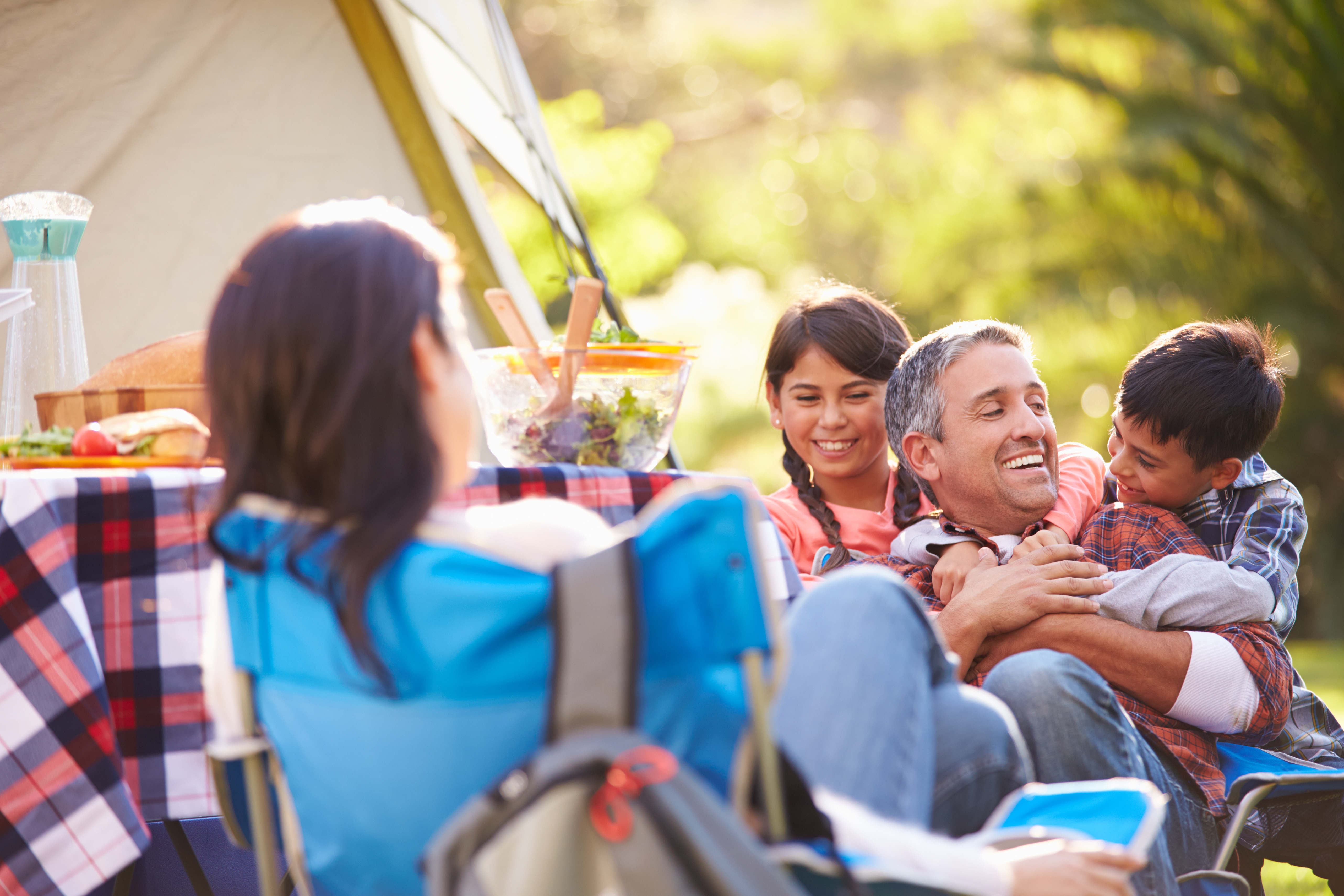 Family Enjoying Camping and Picnic